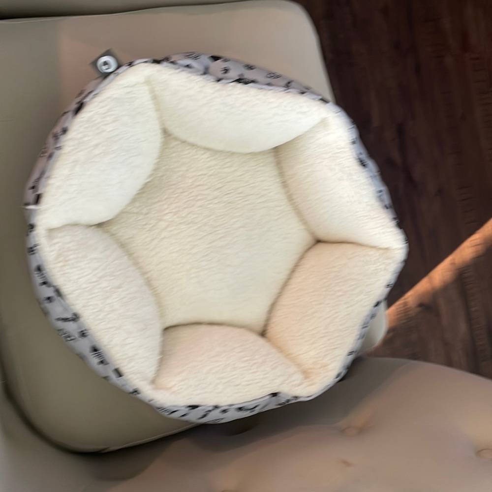 Plush round cat bed.